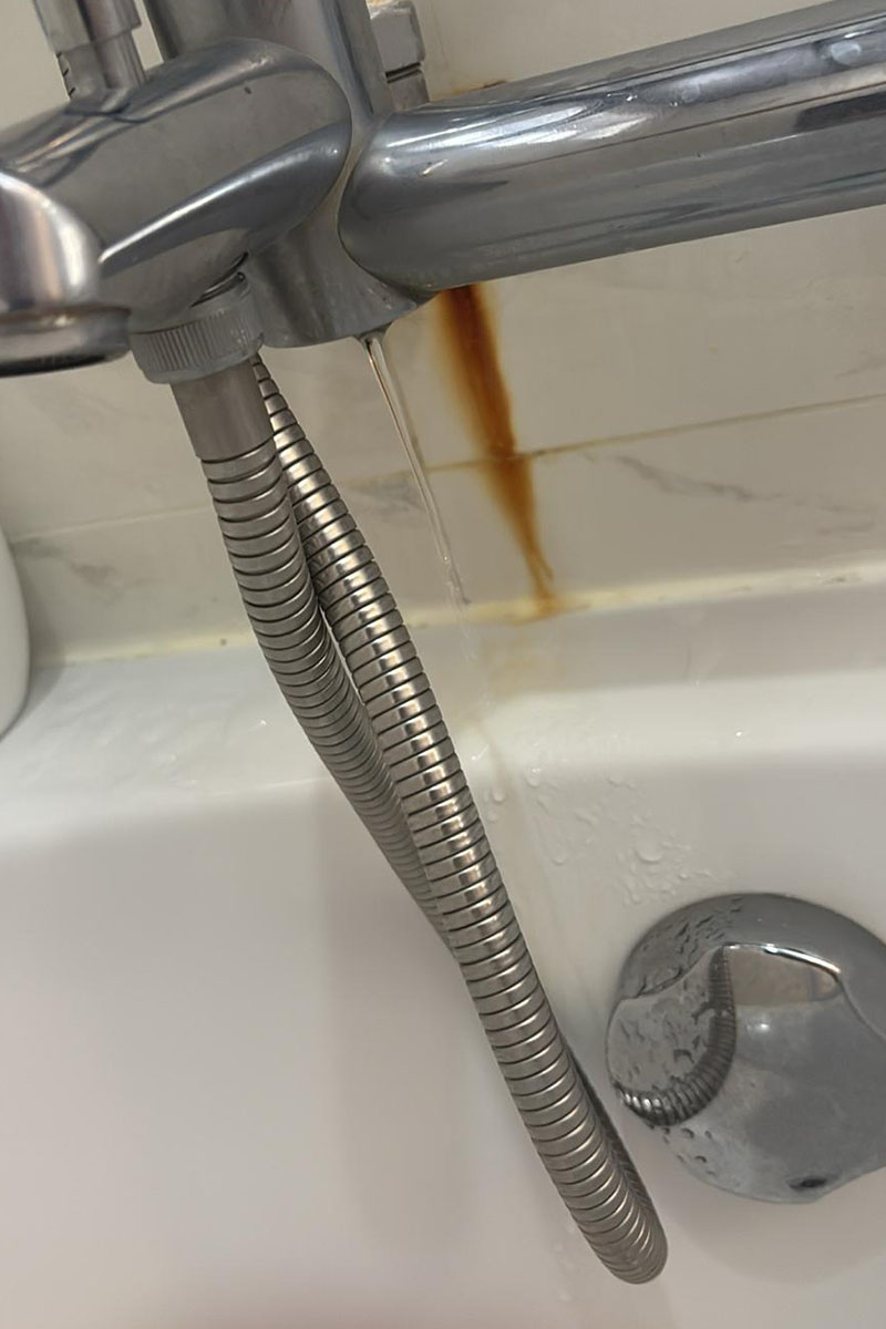 PUB-certified plumber repairing concealed pipe leak in Singapore condo
