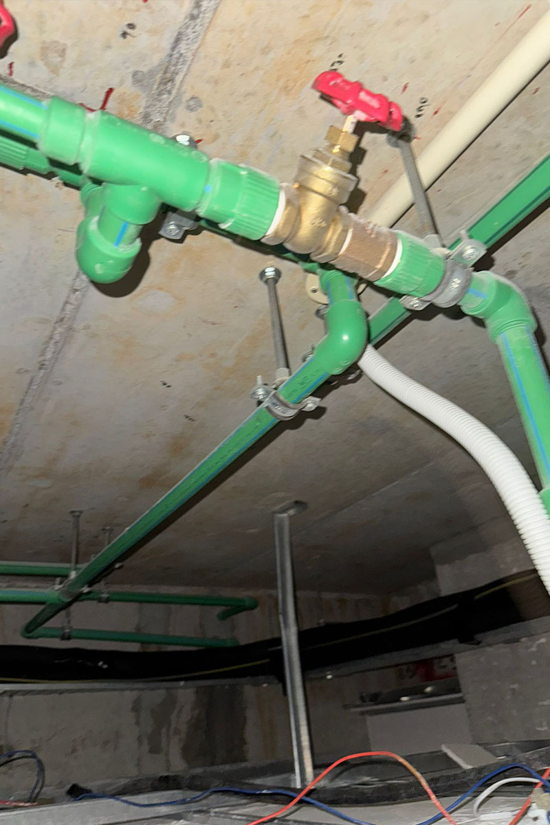 PUB-certified plumber repairing concealed pipe leak in Singapore condo